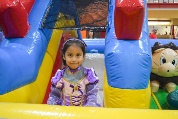 Kid Playing Bouncing House