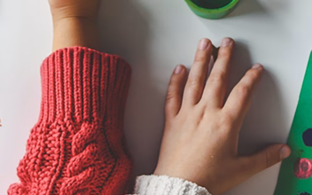 kids making paper Christmas trees
