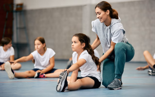 young girls stretching and warming up