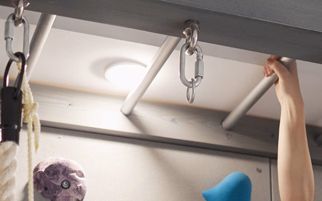 Child doing indoor monkey bars