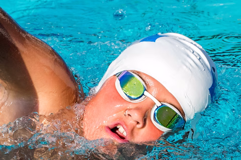 Teen boy swimming